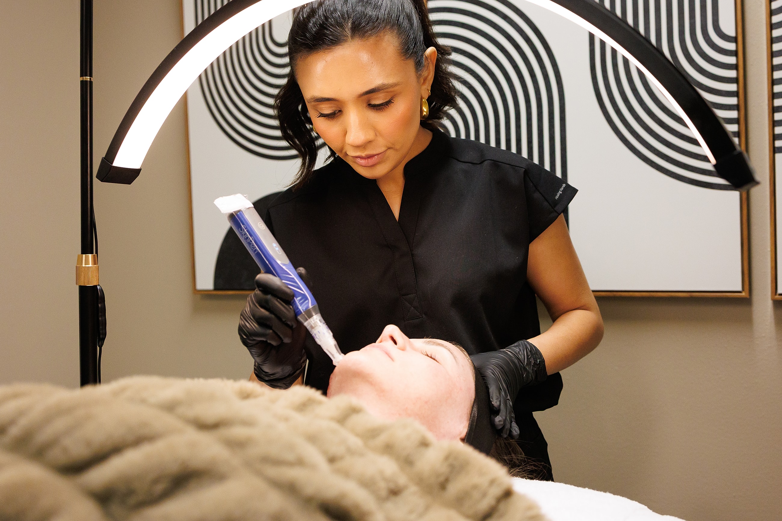 Makeup application by a professional artist.